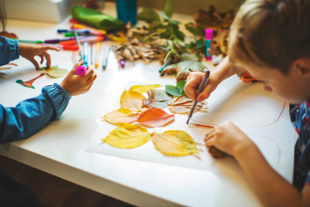 Children doing autumn handcrafts
